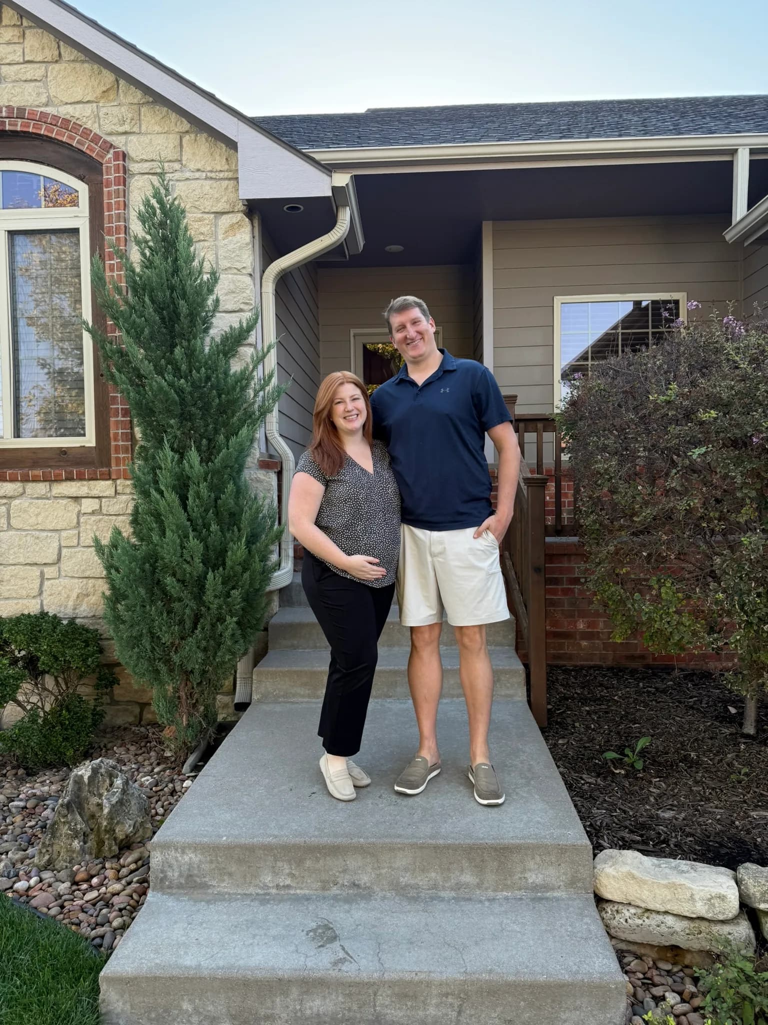 A couple on the porch of their new home