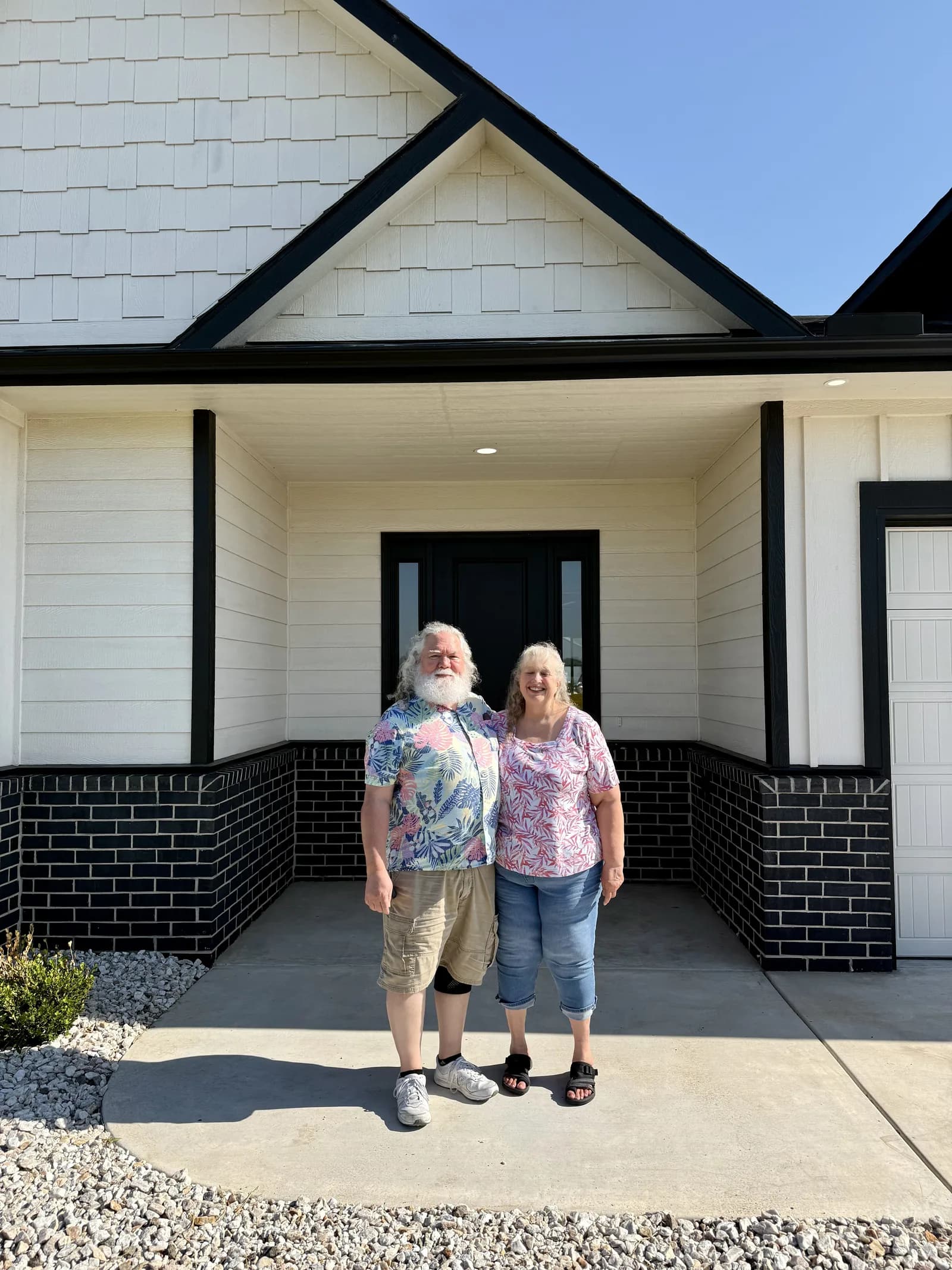 An older couple celebrating their new home