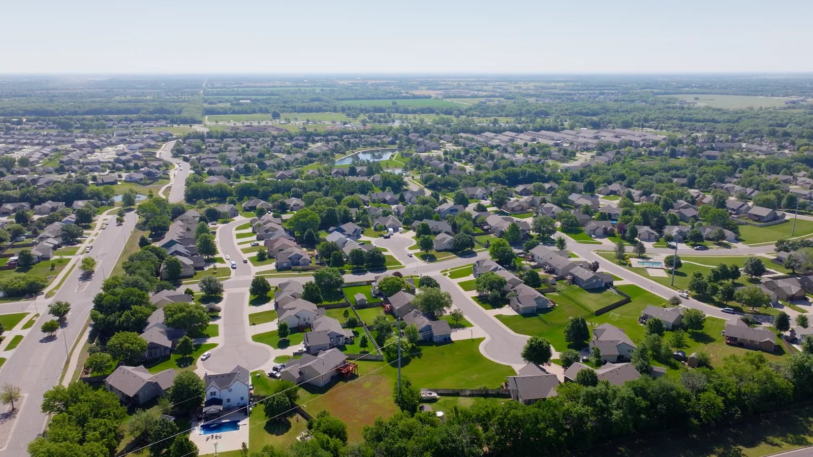 Aerial view of a Derby neighborhood with tidy streets and green lawns
