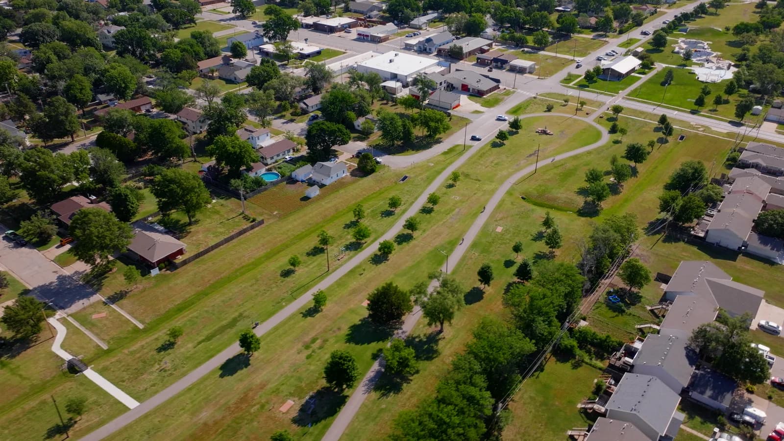 A walking path through a greenbelt between Goddard neighborhoods