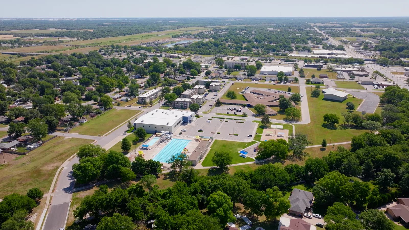 Aerial view of Haysville's outdoor pool surrounded by trees